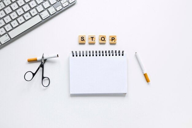 Top view notebook with keyboard and scissors