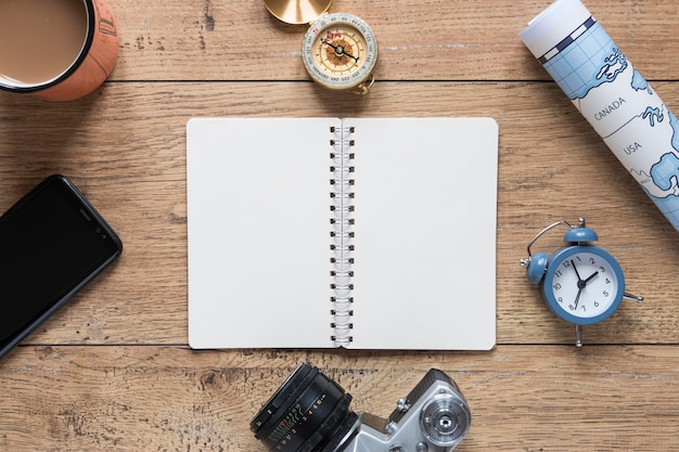 Top view notebook on wooden background