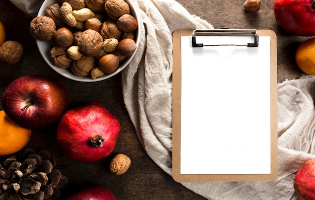 Top View of Notepad with Autumn Fruits and Nuts