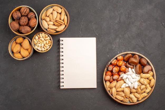 Top view of nut composition walnuts and other nuts on grey surface