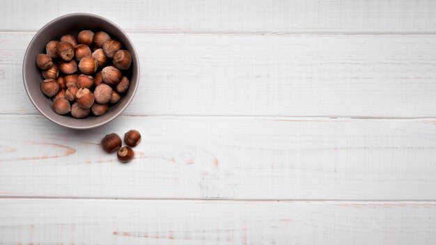 Top view nuts in a bowl with copy space