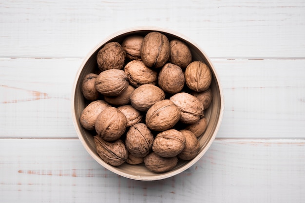 Top view nuts in a bowl with copy space