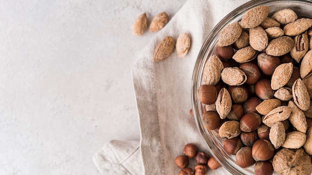 Free photo top view of nuts in bowl with copy space