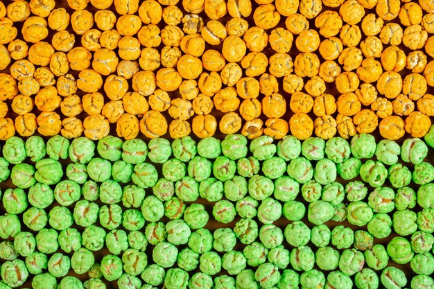 Top view of nuts glazed with sugar background