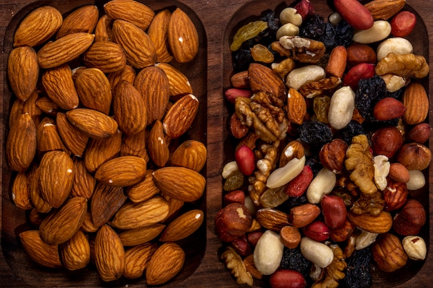 Top view of nuts mix and almond on a wooden tray