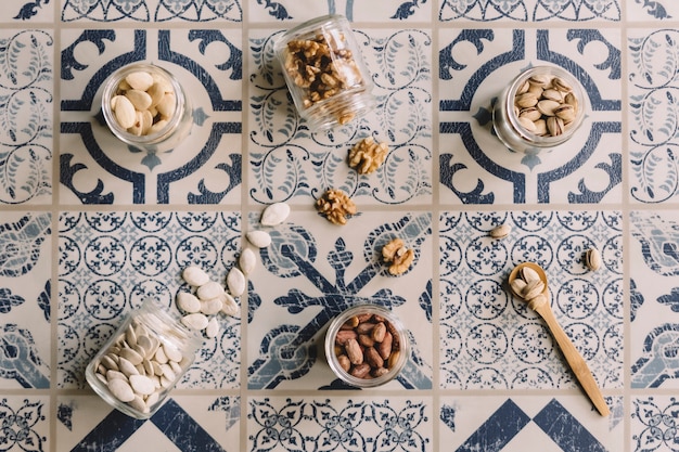 Top view of nuts on tiles