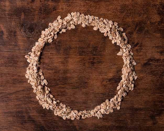 Free photo top view oatmeal circular frame