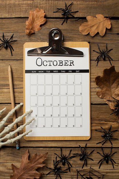 Top view october calendar and leaves