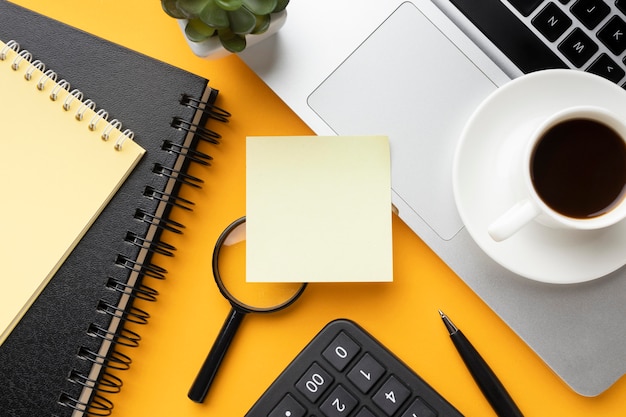 Top view office desk composition with empty post it