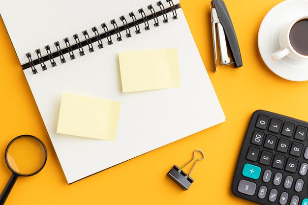 Top view office desk composition with post its