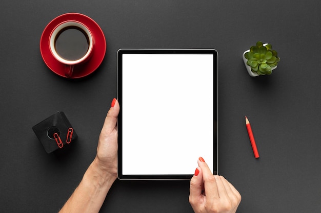 Top view office desk composition with tablet