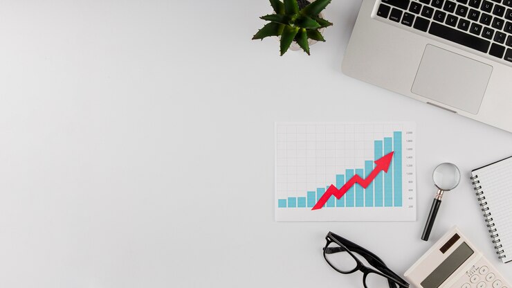 Free Photo top view of office desk with growth chart and copy space