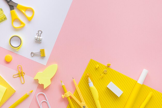 Top view of office stationery with compass and paper clips