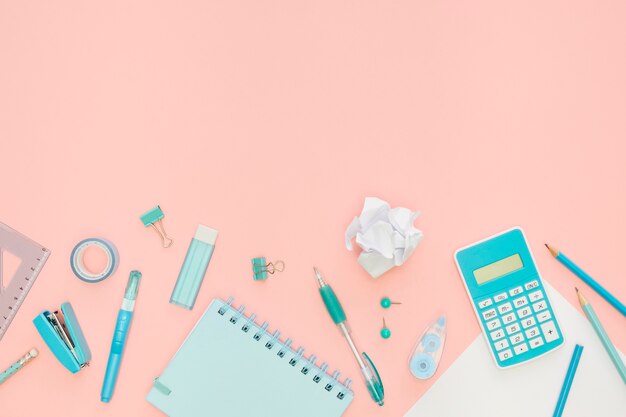 top view of office stationery with notebook and calculator