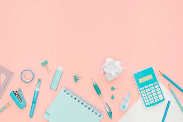 Top view of office stationery with notebook and calculator