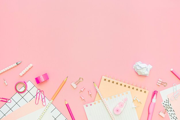 Top view of office stationery with notebook and copy space