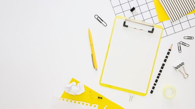 Top view of office stationery with notepad and pen