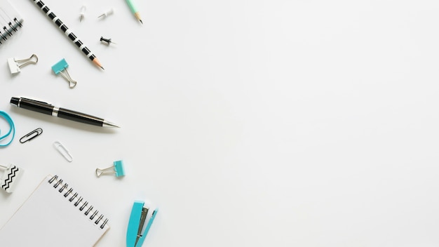 Top view of office stationery with pen and notebook