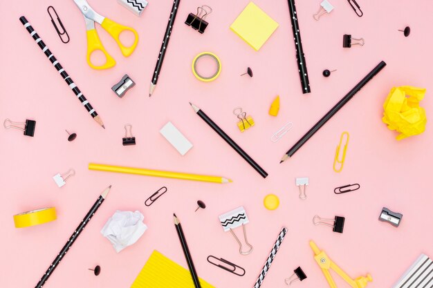 top view of office stationery with pencils and paper clips
