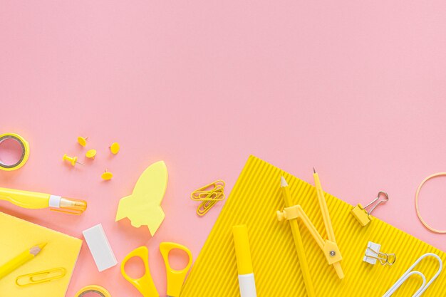 Top view of office stationery with scissors and compass