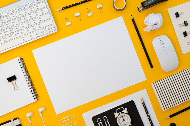 Top view of office supplies with keyboard and mouse