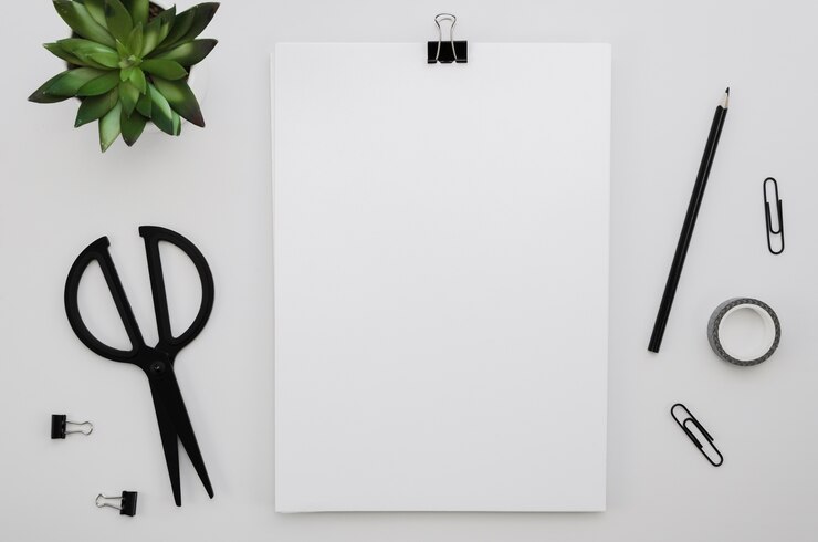 Free Photo top view of office supplies with scissors and plant