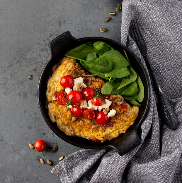 Top view omelette and cherry tomatoes