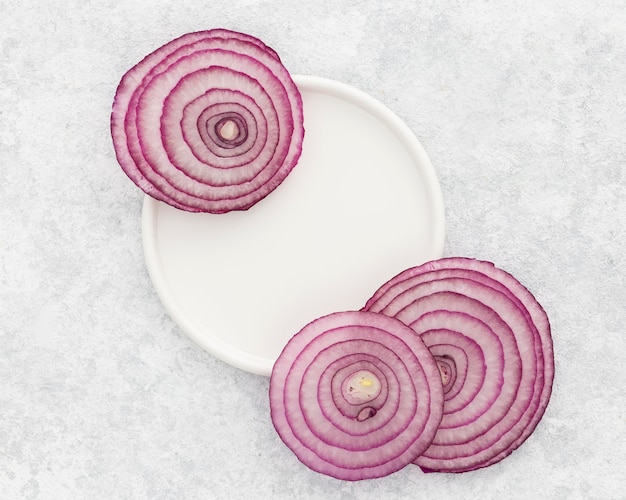 Top view onion slices on the table