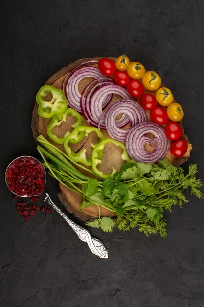 top view onions pepper tomatoes fresh sliced whole on the dark floor