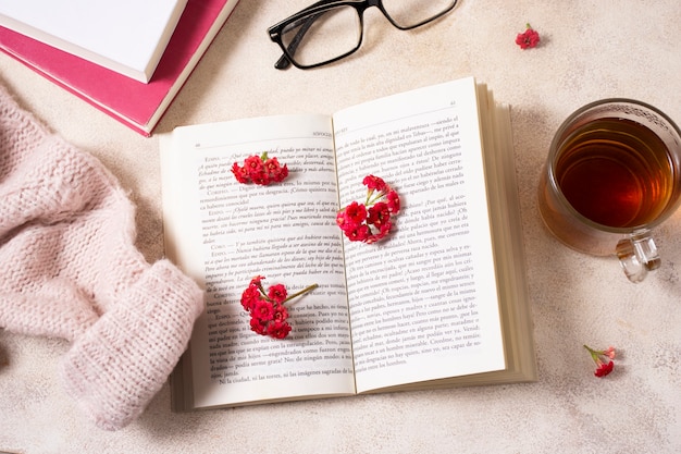 Top view open book and flowers