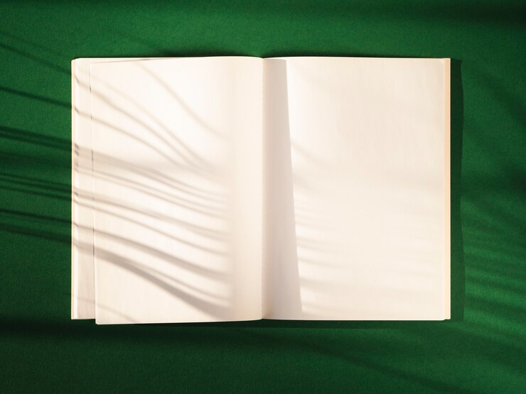 Free Photo top view open notebook with shadows
