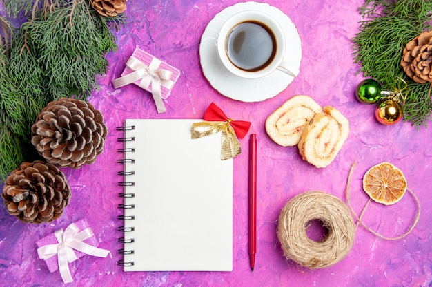 Free photo top view open notepad with cones and tea