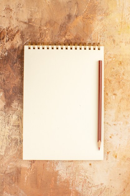 Top view open notepad with pencil