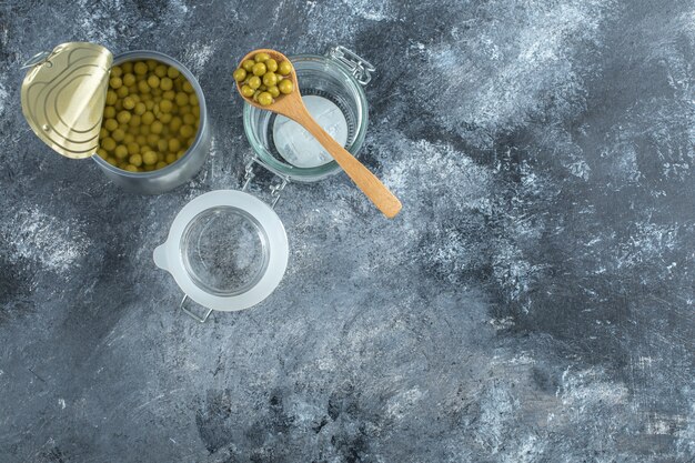 Top view of Opened peas tin with jar