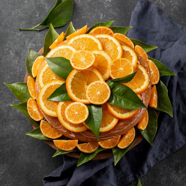 Top view of orange cake with leaves