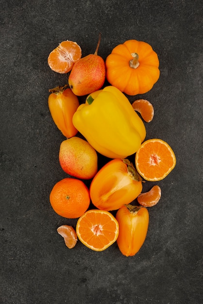 Free photo top view orange fruits and vegetables