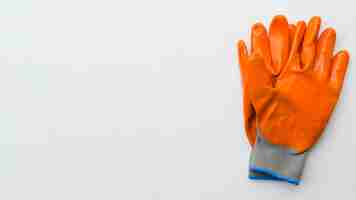 Free photo top view orange gardening gloves