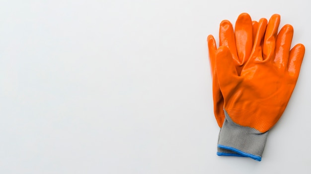 Top view orange gardening gloves