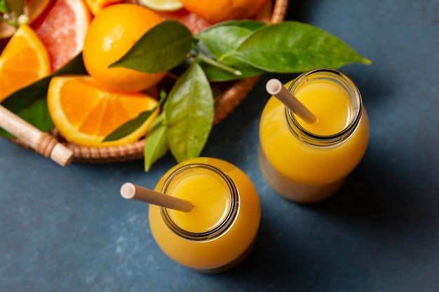 Top view orange juice with citrus mix