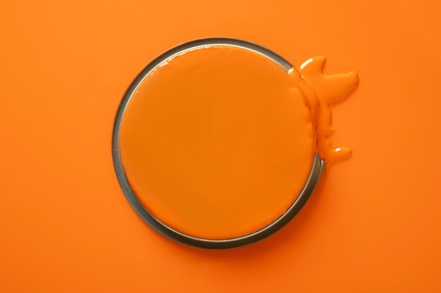 Top view orange paint can