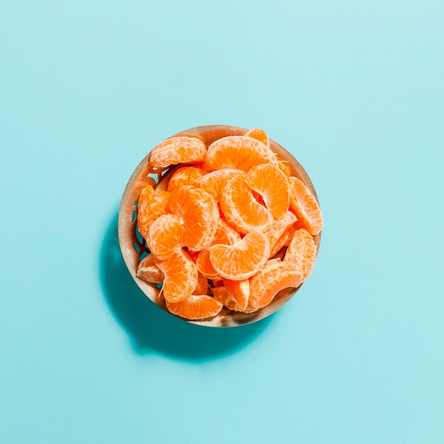 Top view orange slices in bowl