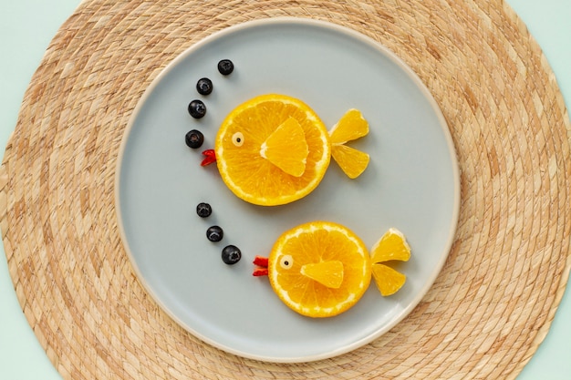 Top view orange slices on plate arrangement