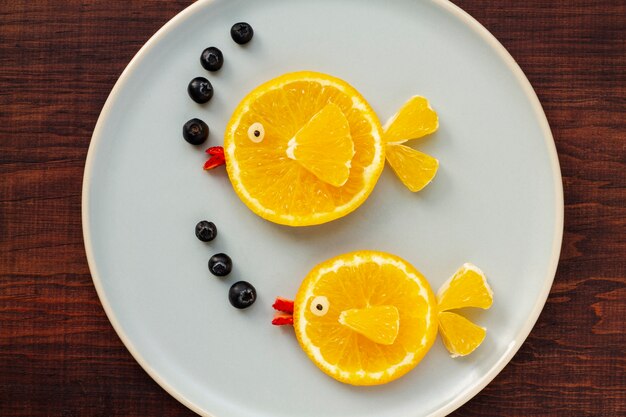 Top view orange slices on plate assortment