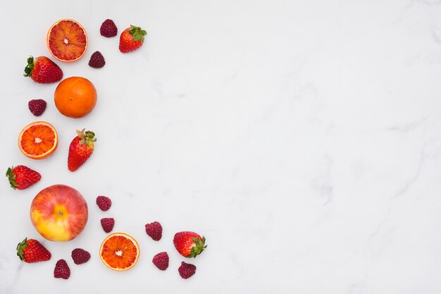 Top view oranges and strawberries