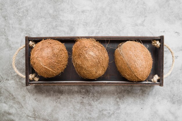 Top view organic coconuts on the table