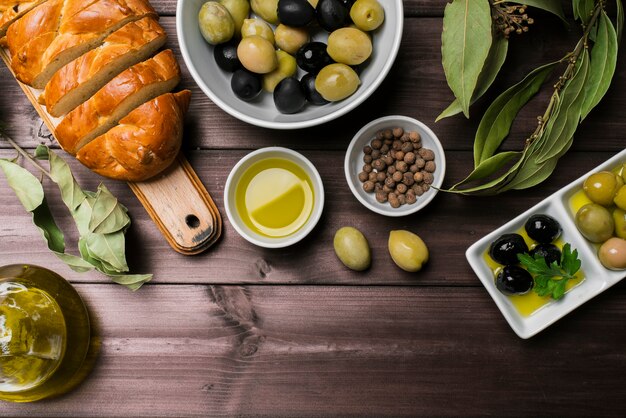 Top view organic olives and homemade bread