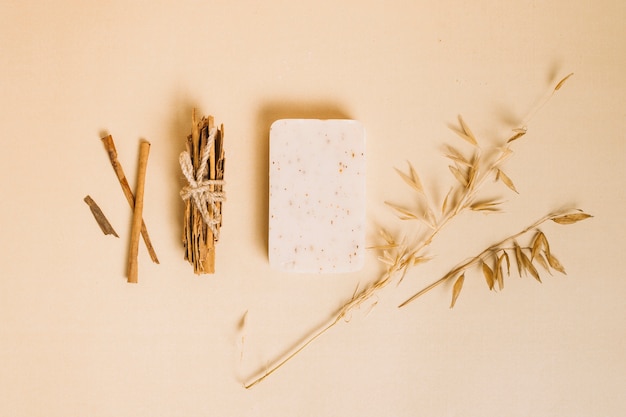 Top view organic soap bar with decorative plants around