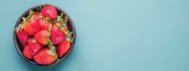 Top view organic strawberries with copy space