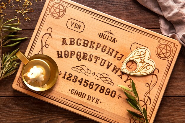 Top view ouija board and candle