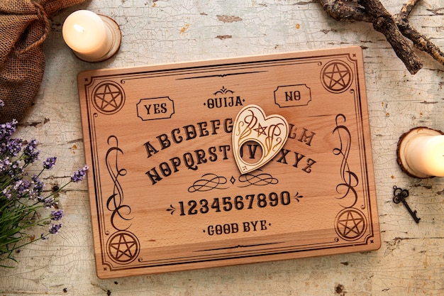 Top view ouija board and candles arrangement